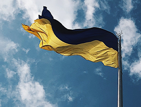 flag of ukraine pictured against bright blue sky